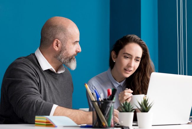 colleagues-brainstorming-together-office_23-2148513792